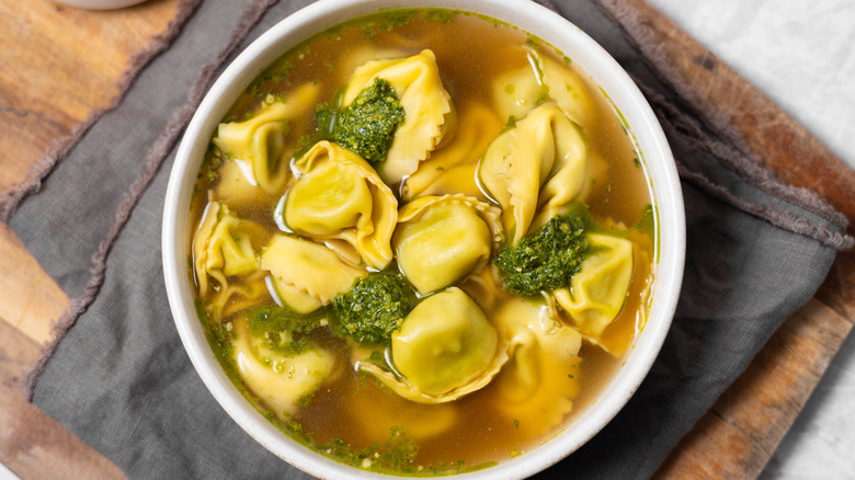 pesto tortellini soup in bowl