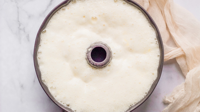 Uncooked angel food cake batter in a Bundt cake pan