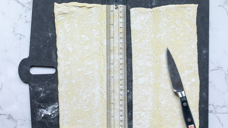 puff pastry sheet being cut