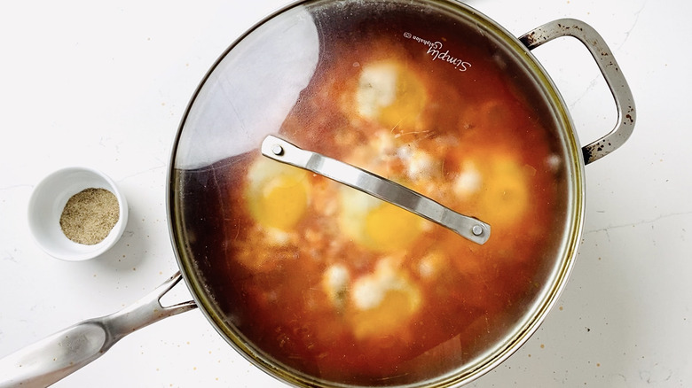 covered shakshuka in pan