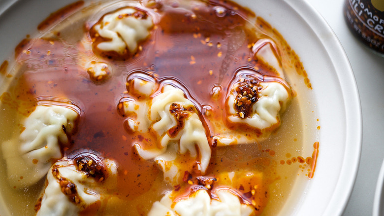 dumpling soup in white bowl