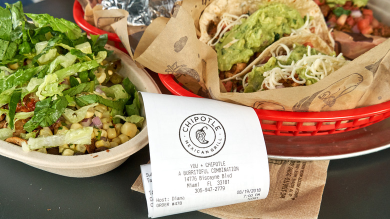 Chipotle tacos and burrito bowl with receipt