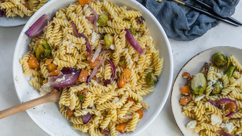 Feta, vegetables, fusilli in bowl