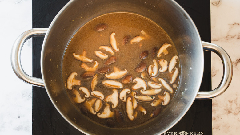 broth and mushrooms in pot