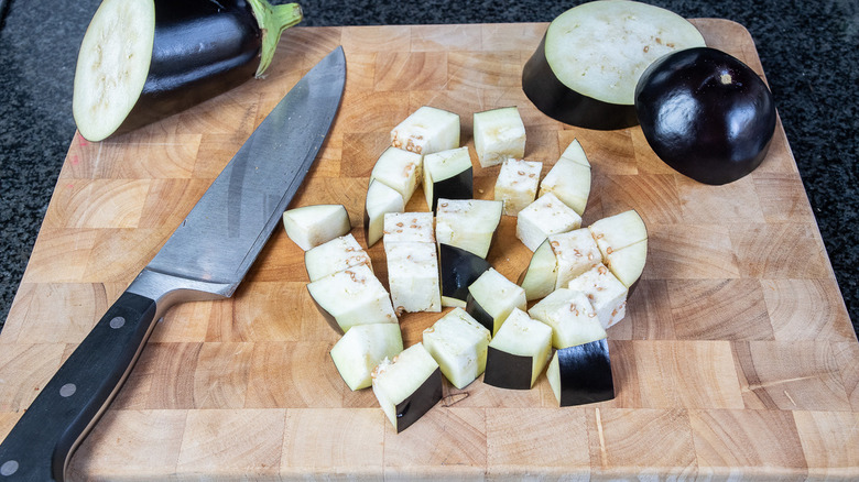 Chopped eggplant with knife