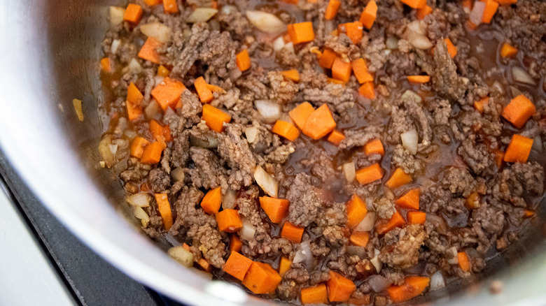 Meat and vegetables cooking in pot