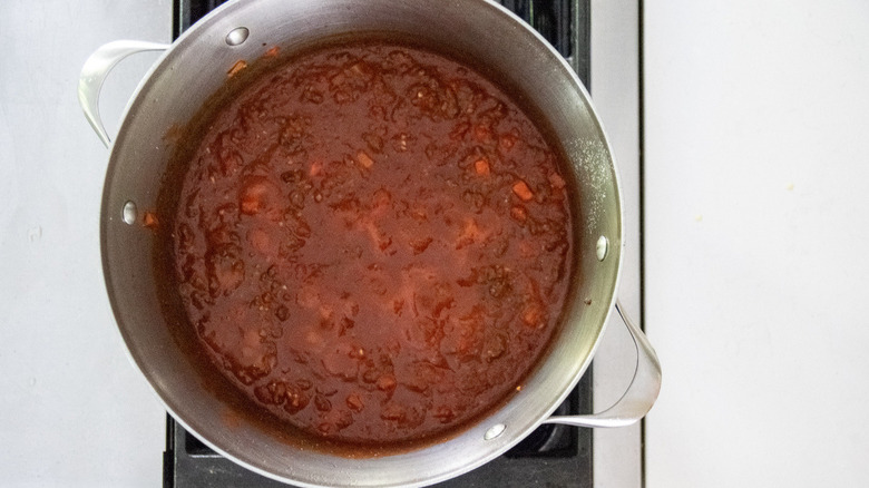 Wine tomato sauce simmering in pot