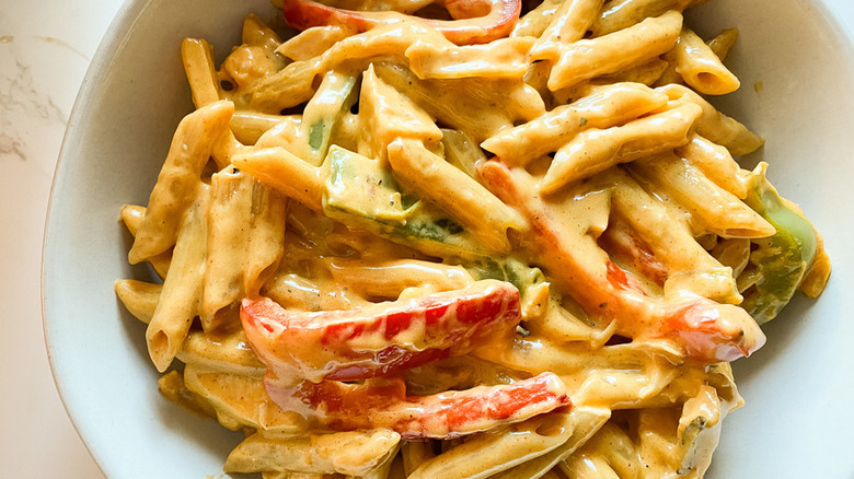 Ziti and sliced bell peppers with a creamy sauce. 