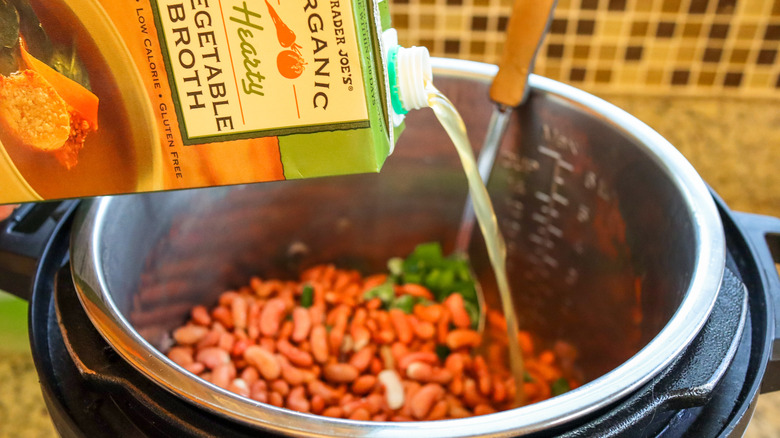 broth pouring into pot