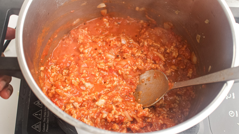 cooking ragu in a pot