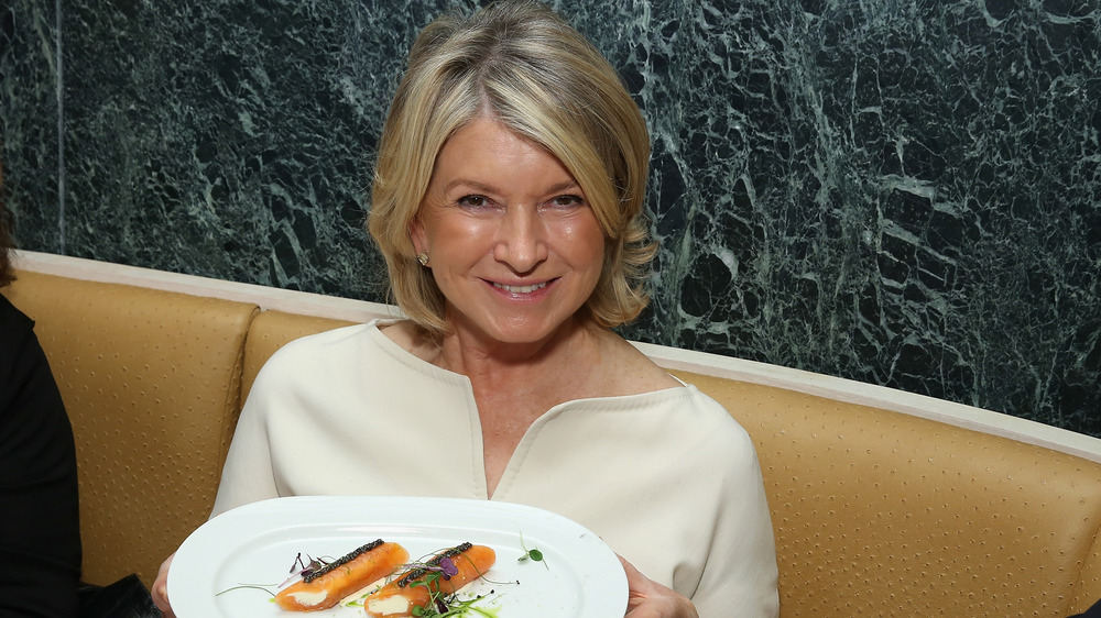 Martha Stewart holding a plate of food