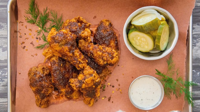 Hot wings with pickles and a dip