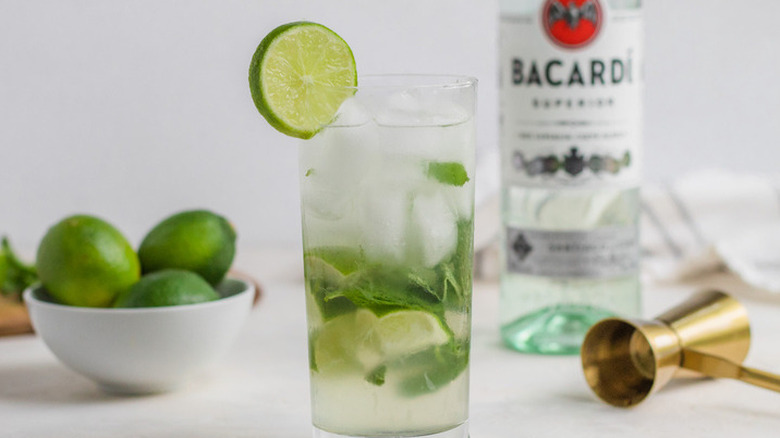 Mojito drink with lime, mint leaves, and Bacardi rum.