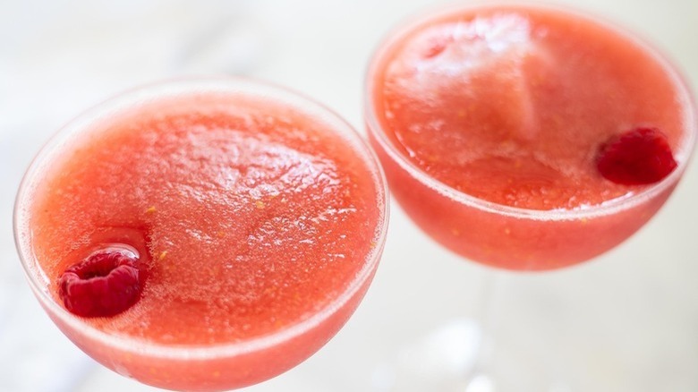 pink slushy drink with raspberries