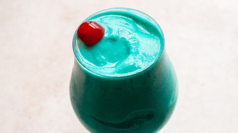 creamy blue drink with cherry
