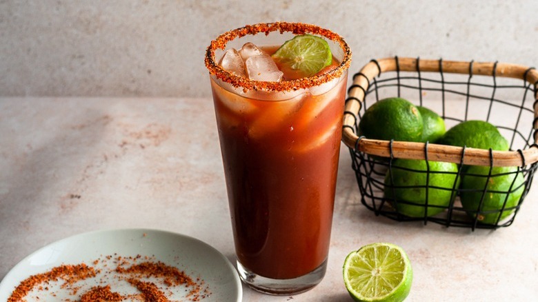 michelada with basket of limes