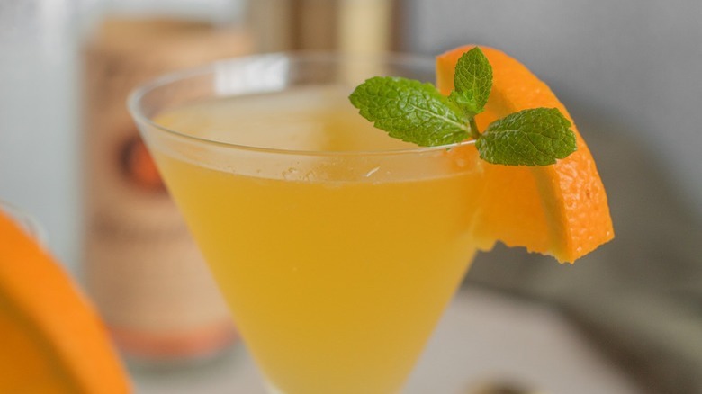 orange drink in martini glass