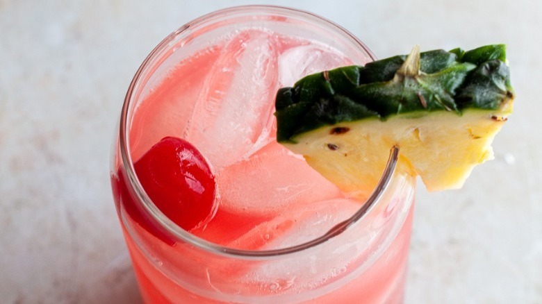pink drink with pineapple wedge