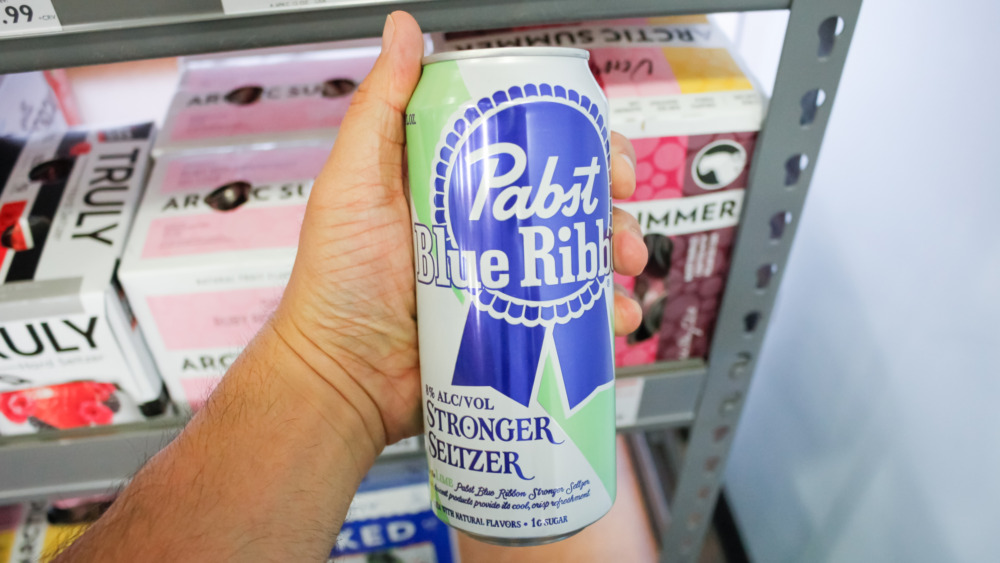 Person holding a PBR hard seltzer