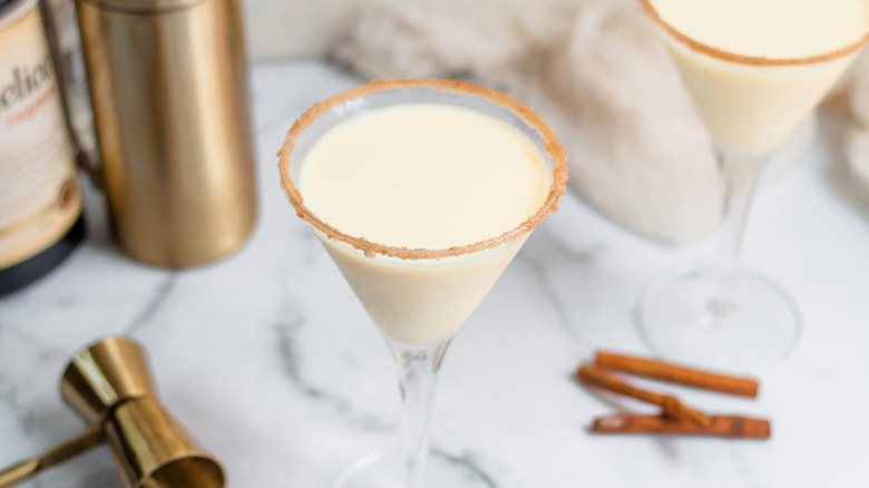 Cocktail glass with milky drink and coated rim