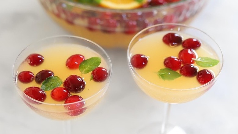 Stemmed glasses of punch with cranberries