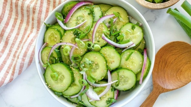 Cucumber salad with red onion, mint, and scallions. 