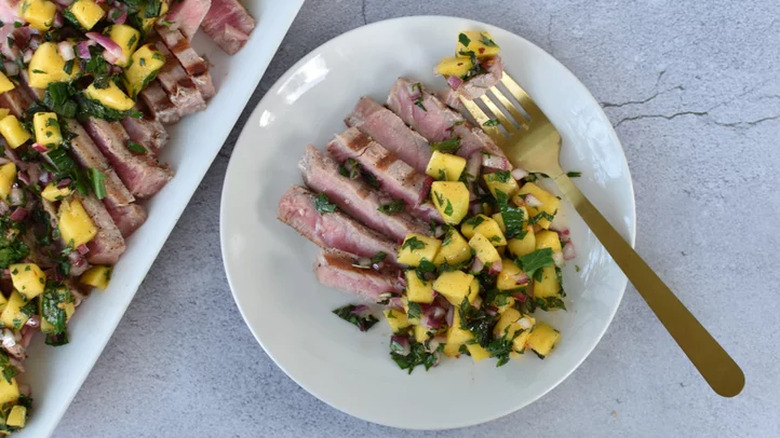 Grilled tuna slices with mango mint relish.