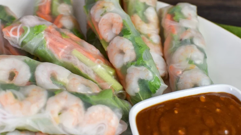 Spring rolls with clear wrappers, shrimp, and vegetables.