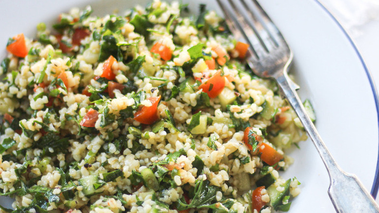 Tabbouleh with cooked bulgur, mint, and diced tomatoes.