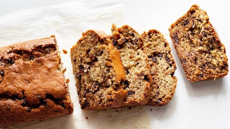 Slices from loaf of chocolate chip-filled banana bread.