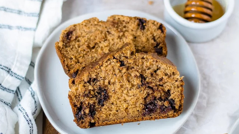 Two slices of chocolate chip banana bread on a plate. 