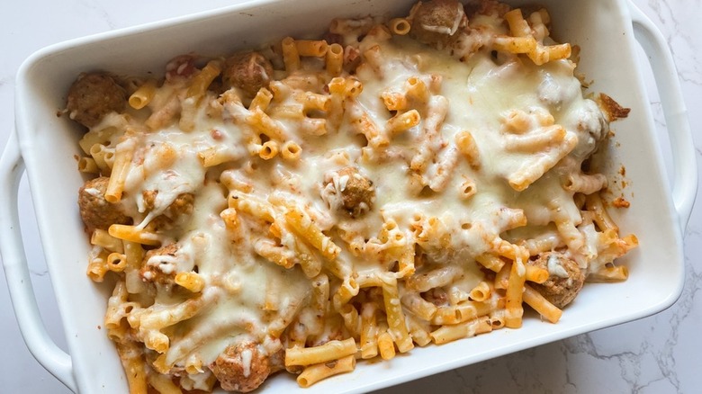 Meatballs in pasta bake with cheese