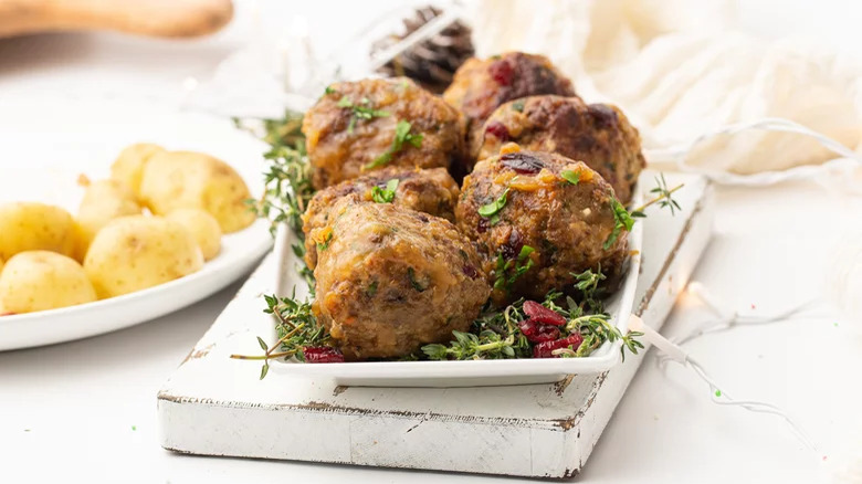 Meatballs with dried cranberries and boiled potatoes