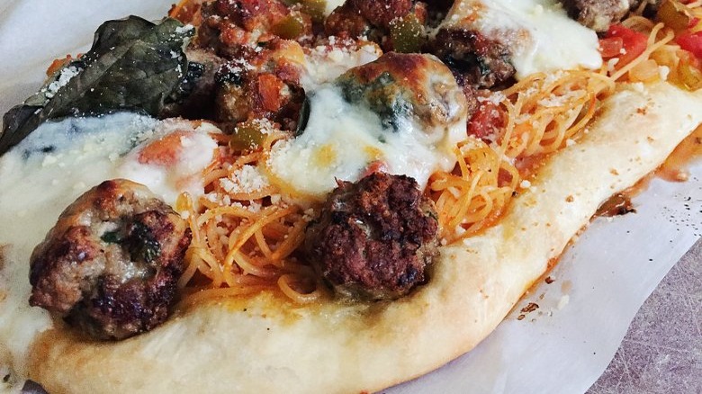 Meatballs and spaghetti on pizza 