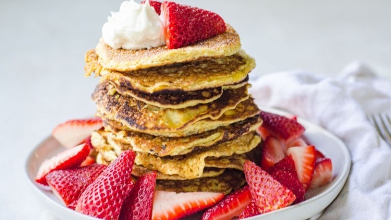 pile of pancakes with strawberries