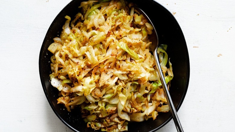 cooked cabbage in black pan