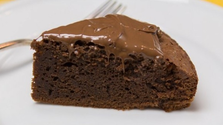 Slice of chocolate cake with chocolate frosting