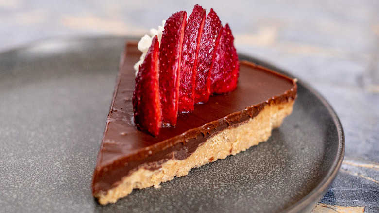 Slice of chocolate topped peanut butter pie