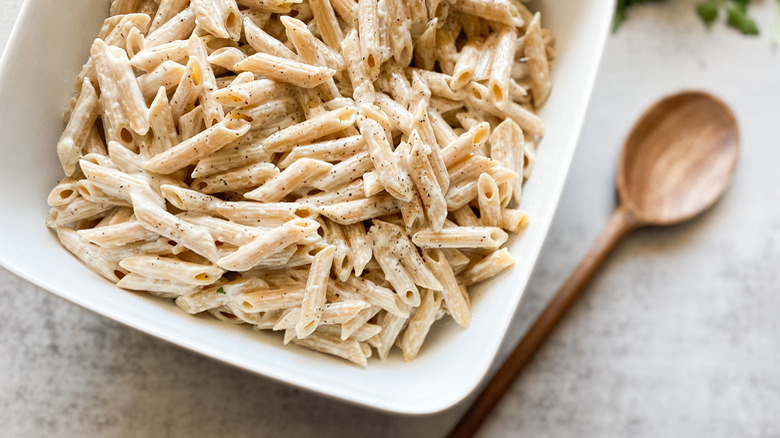 penne pasta in white bowl