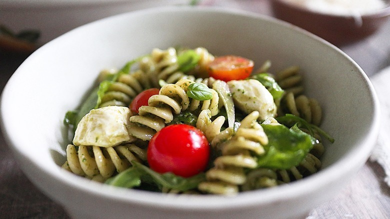 green-sauced pasta with tomatoes