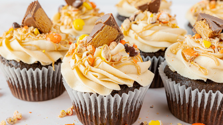 Chocolate cupcakes with frosting and candies