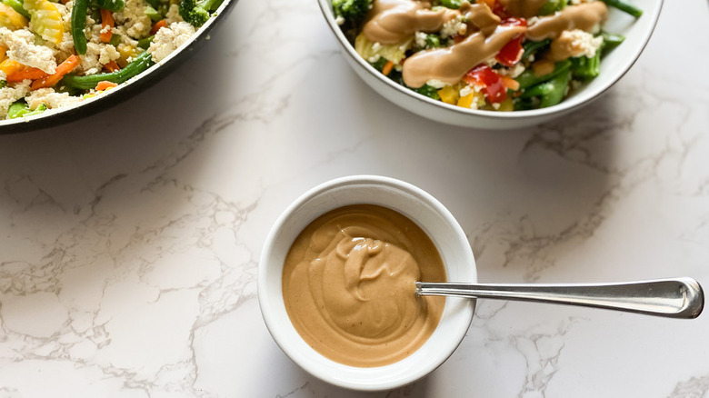 Small dish of creamy peanut butter sauce