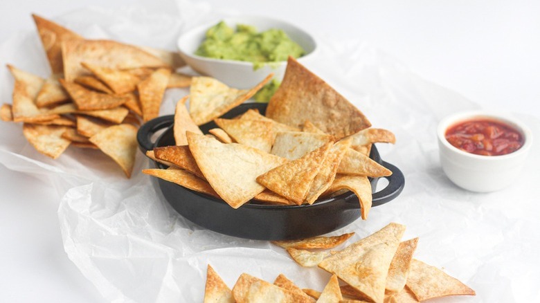 tortilla chips in black bowl