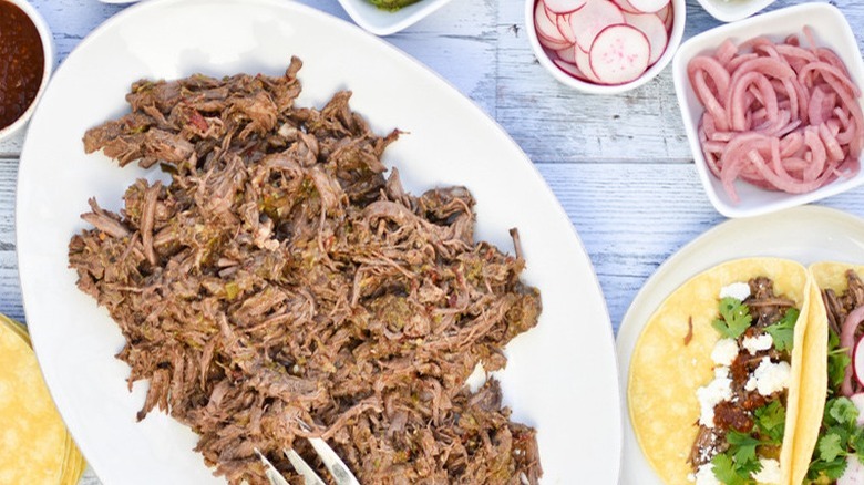 shredded beef on white plate