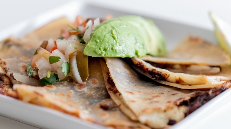meat-filled quesadilla with avocado