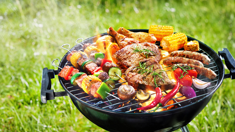 Vegetables and meat on grill