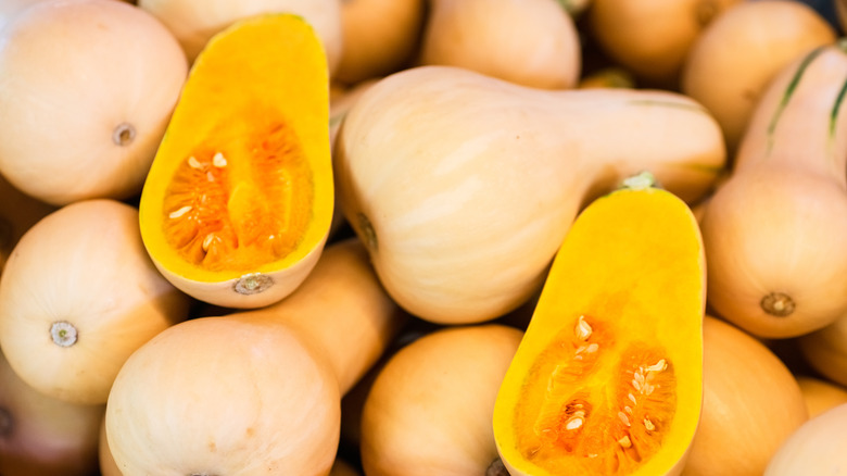 Whole and halved butternut squashes 