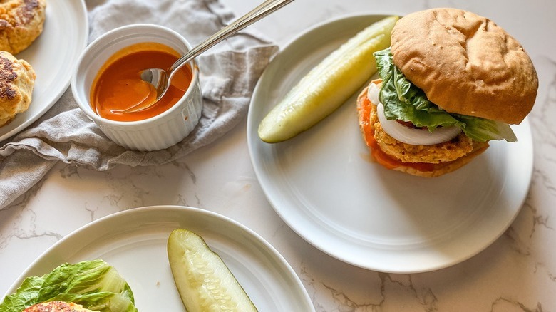 chicken burger with pickle spear