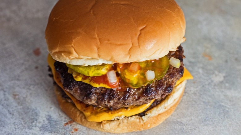 cheeseburger with ketchup and mustard