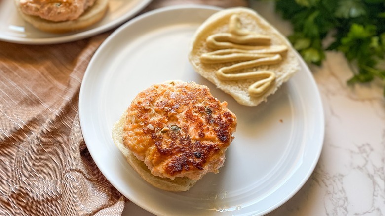 salmon burger on white plate